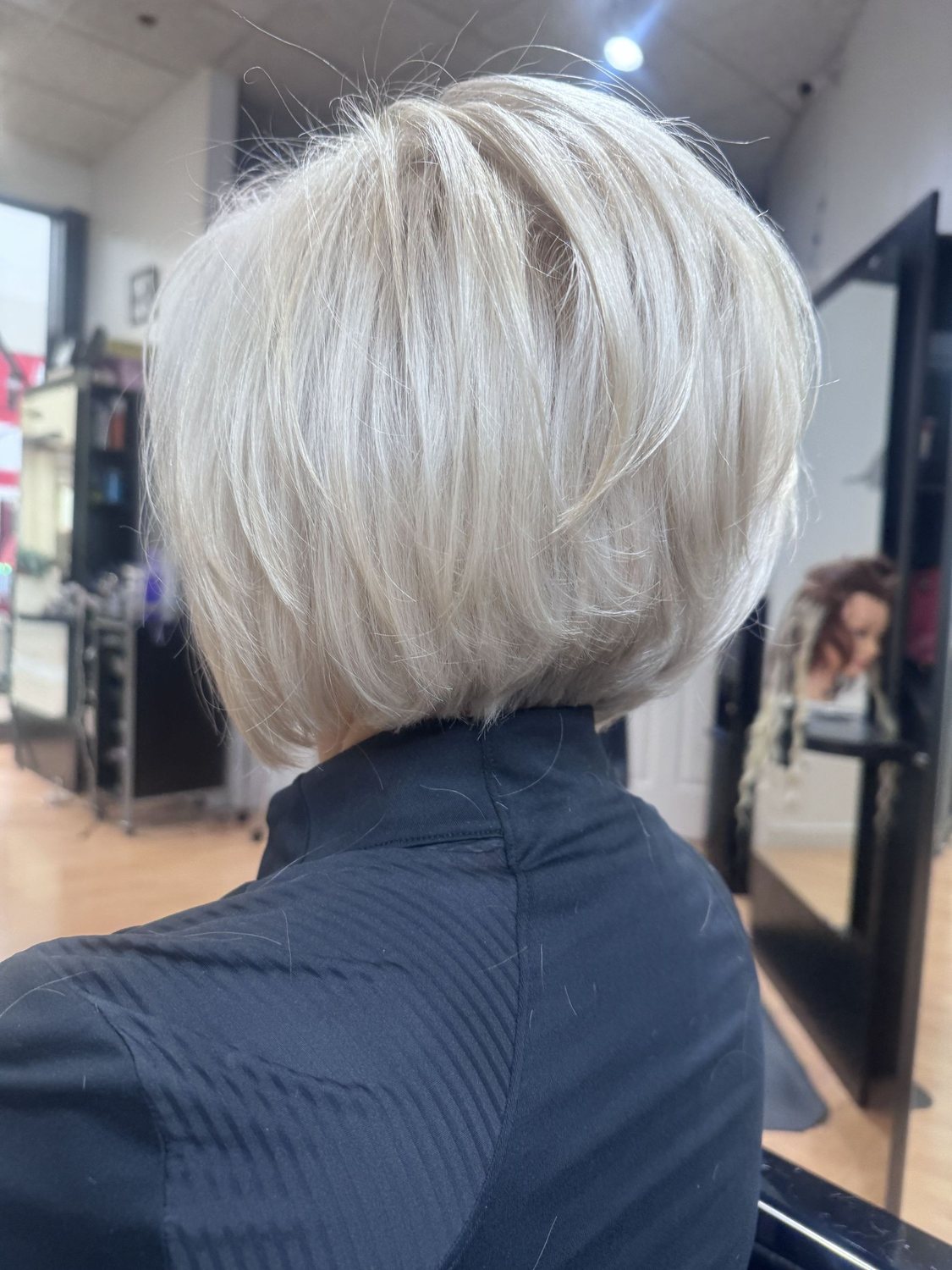 Icy platinum stacked bob, cut and toned in the salon